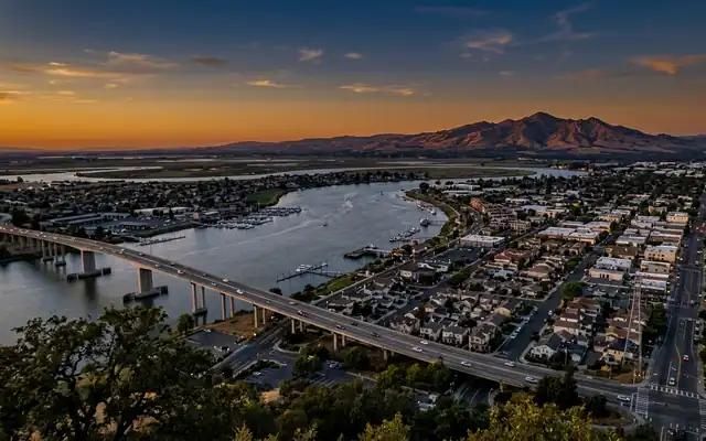 Antioch at dusk, the Antioch Bridge crossing the San Joaquin River with Mount Diablo rising on the horizon