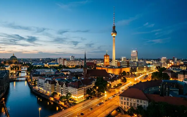 Berlin skyline at dusk, the TV Tower above the city and the Spree river
