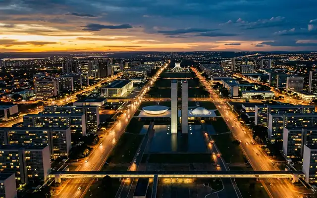 The National Congress towers on Brasília's Monumental Axis lined by ministry blocks at dusk