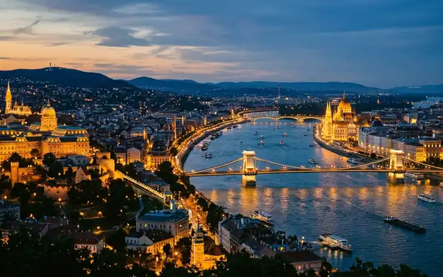 The Chain Bridge and Hungarian Parliament along the Danube in Budapest at dusk