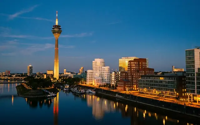 The Rhine Tower and the Media Harbour in Düsseldorf at dusk