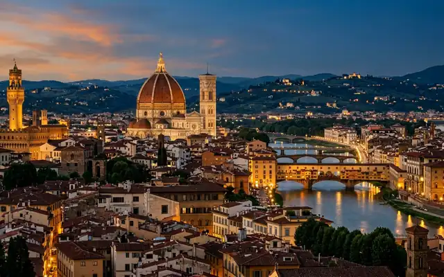 The Duomo dome, Palazzo Vecchio tower and Ponte Vecchio over the Arno in Florence at dusk