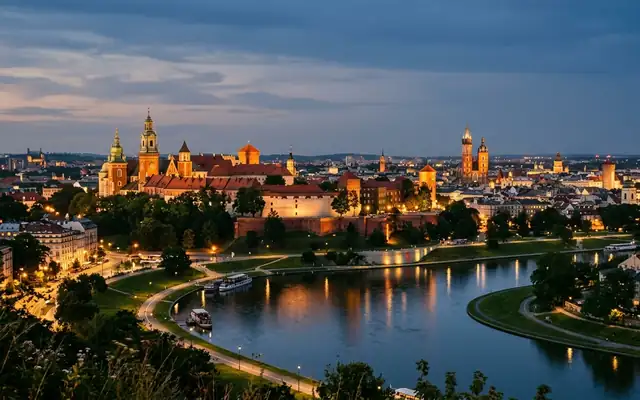 Wawel Castle and cathedral above a bend in the Vistula river with Krakow's old town beyond at dusk