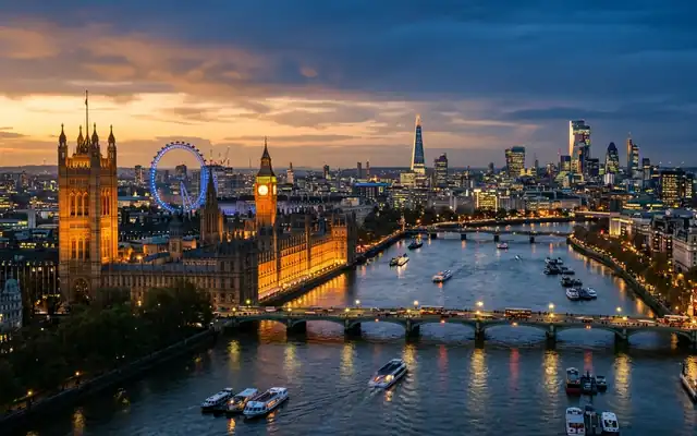 Big Ben and the Houses of Parliament on the Thames in London with the London Eye at dusk
