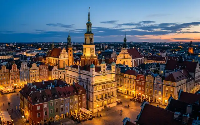 The Renaissance town hall and colourful houses of Poznan's Old Market Square at dusk