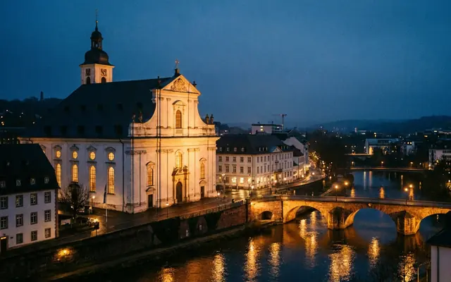 The Ludwigskirche and the Saar river in Saarbrücken at dusk