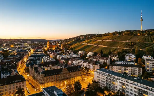 Stuttgart at dusk, the city bowl with vineyard hills and the TV tower