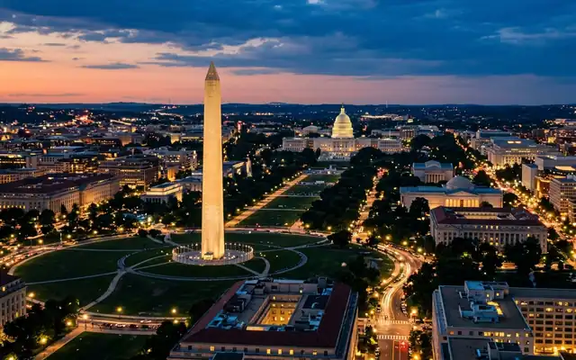 The Washington Monument and distant Capitol dome on the National Mall in Washington, D.C. at dusk