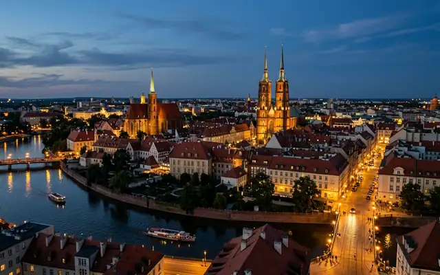 Wroclaw at dusk, the twin Gothic spires of Wroclaw Cathedral on Ostrow Tumski above a bend of the Oder river