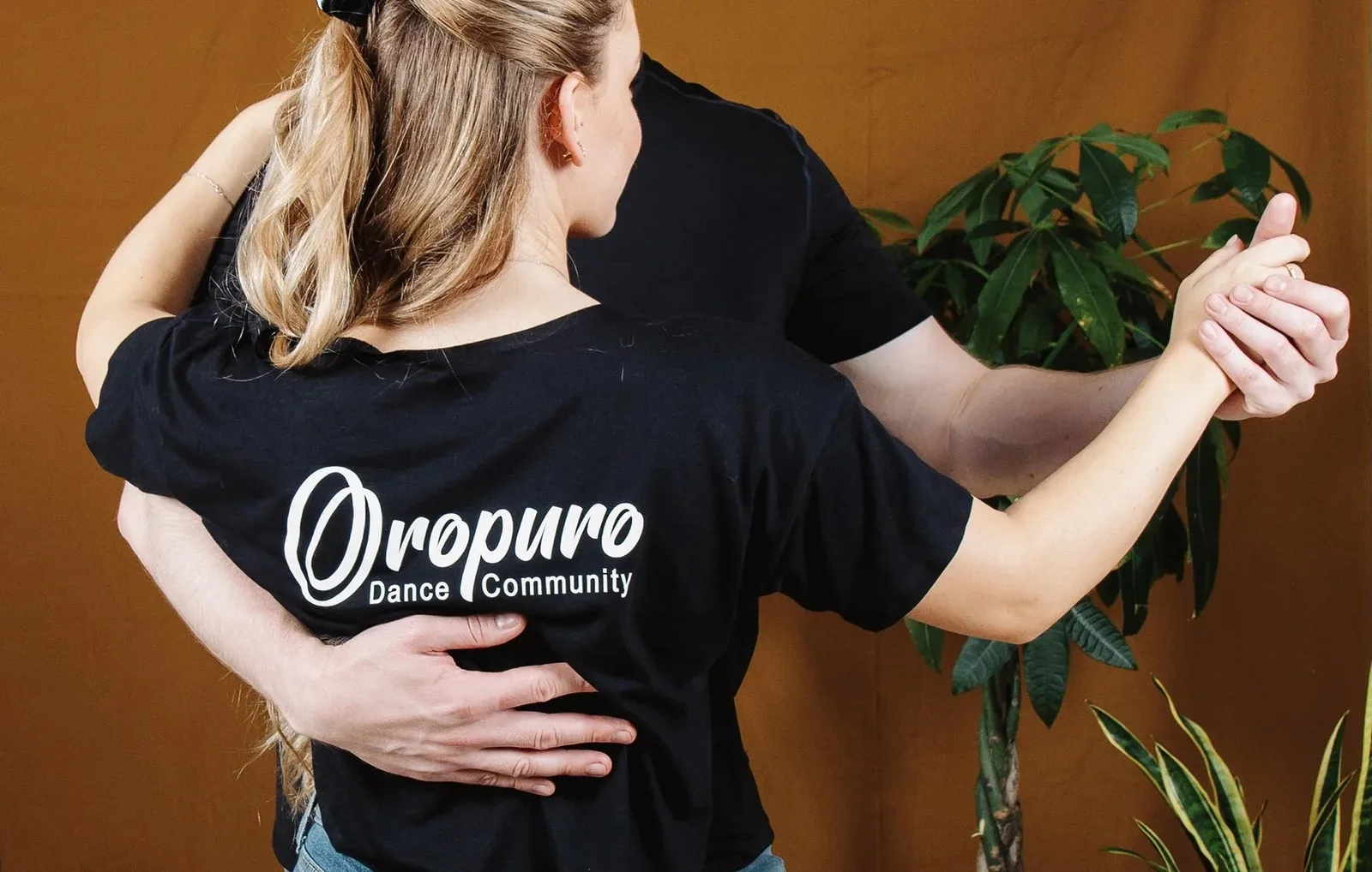 Dancer wearing an Oropuro Dance Community branded shirt