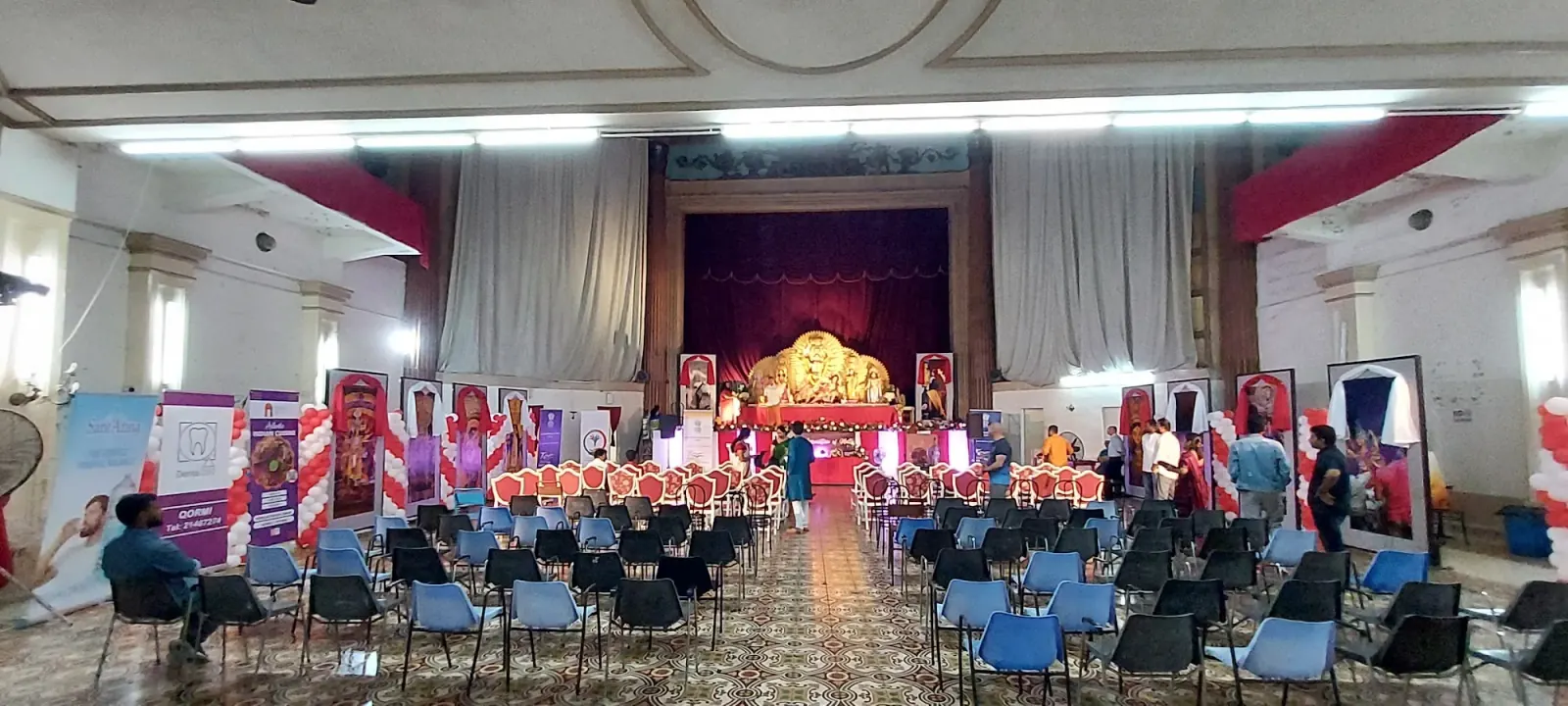 Orpheum Theatre Malta — main hall with proscenium stage and rows of chairs set for an event