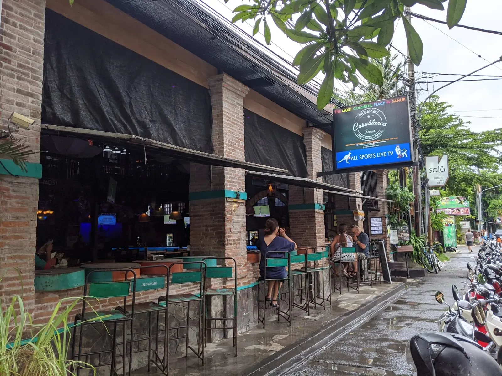 Exterior of Bakfickan Bar (Casablanca) in Sanur, Bali with branded signage and street-side seating