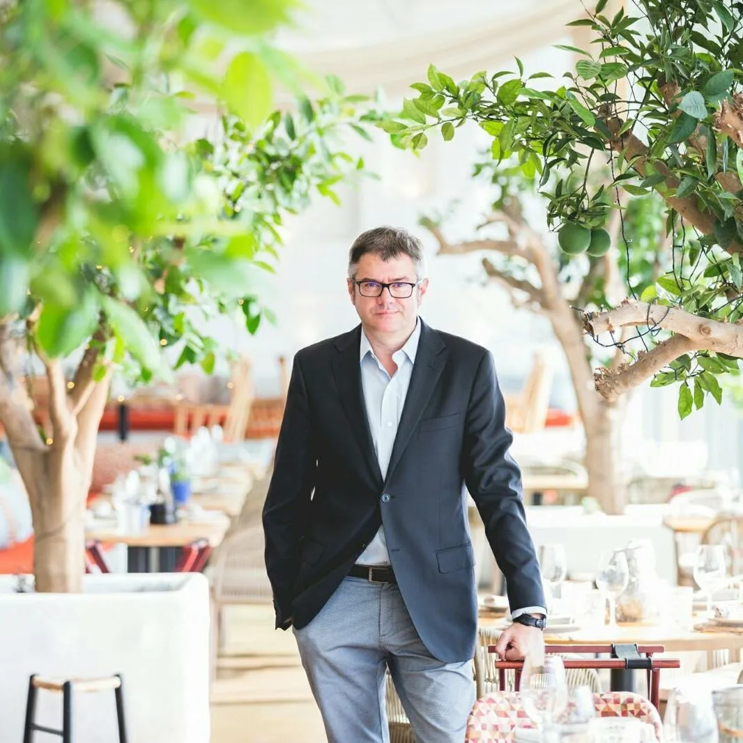 Interior of Veles e Vents venue with citrus trees and dining atmosphere in Valencia