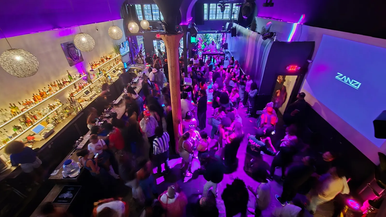 Overhead view of the busy dance floor and bar at Zanzi in Oakland