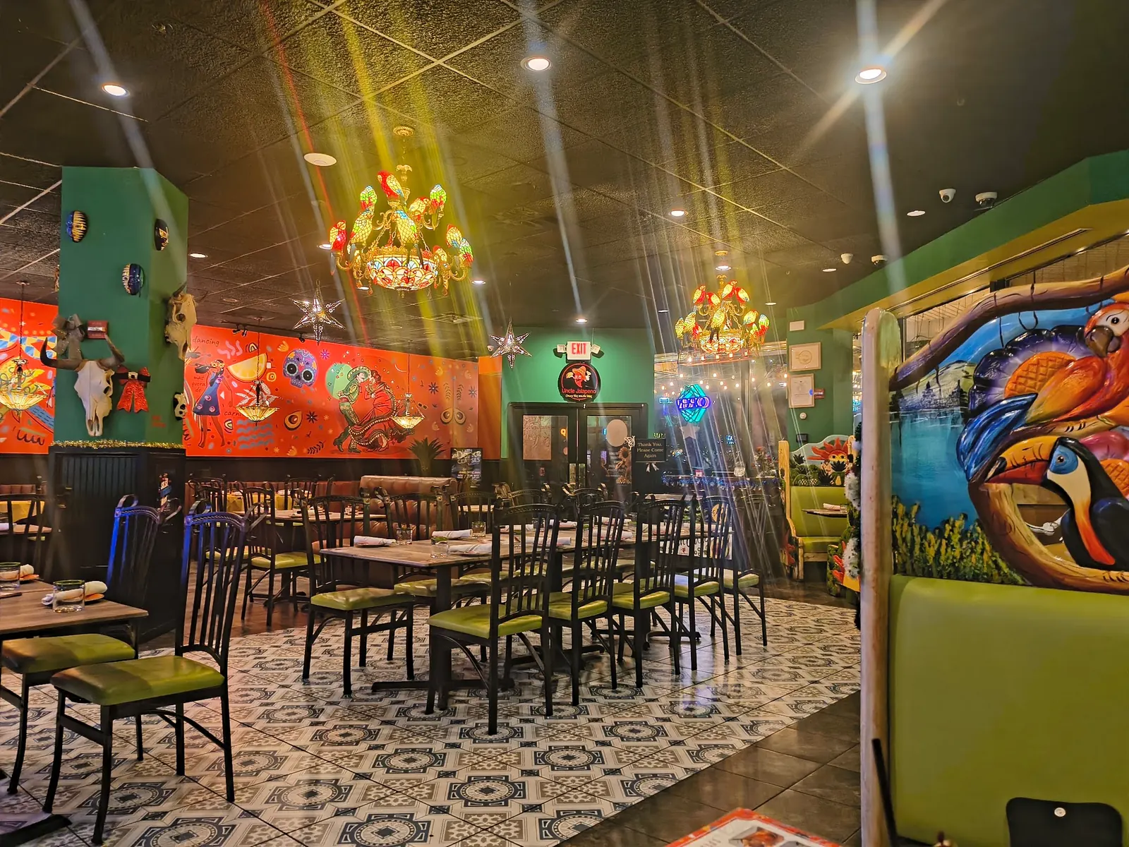 Colorful interior with murals, tiled floor and the Uncle Jalapeno sign in Herndon