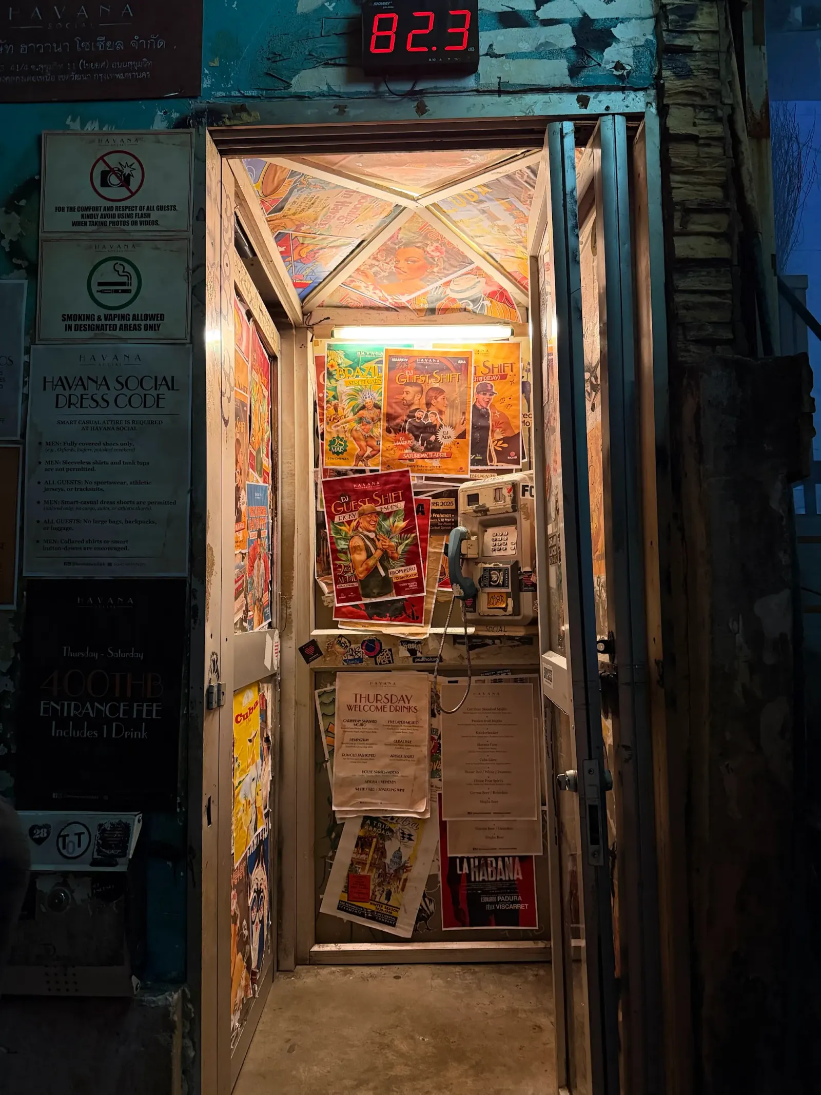 Entrance hallway with posters and dress code signs at Havana Social Bangkok