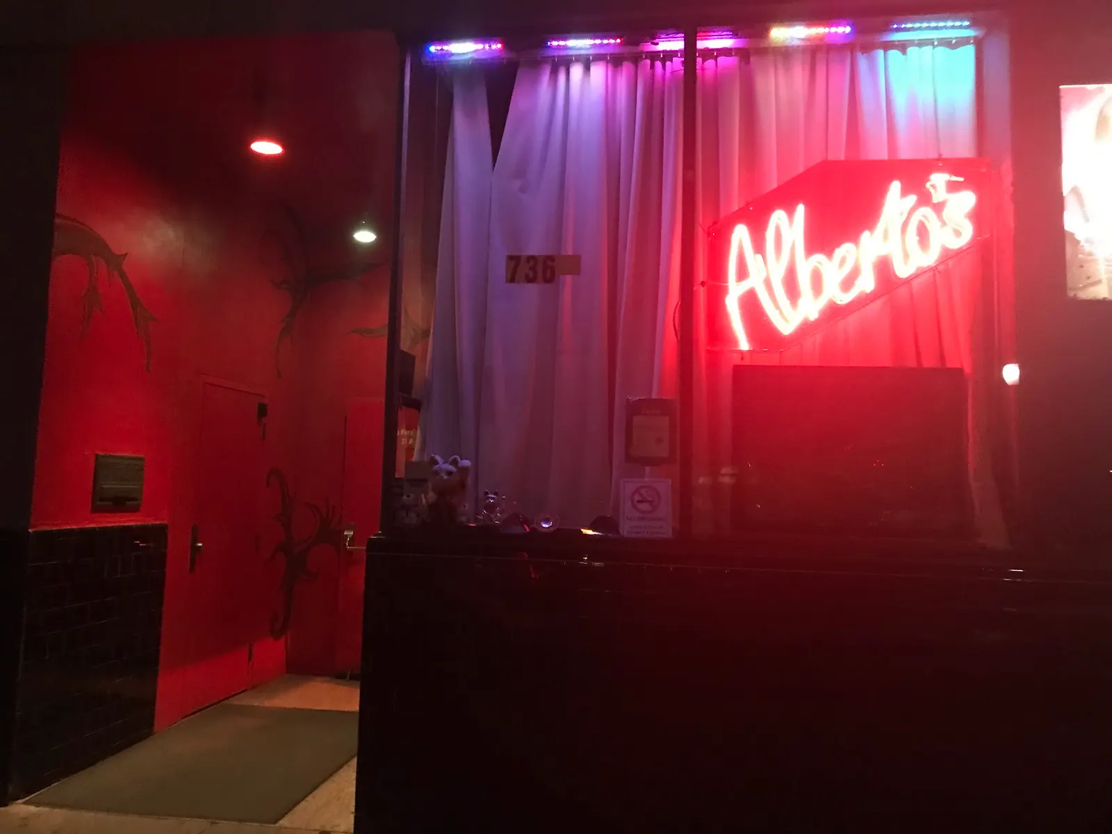 Neon entrance sign above the street door of Alberto's Night Club, Mountain View