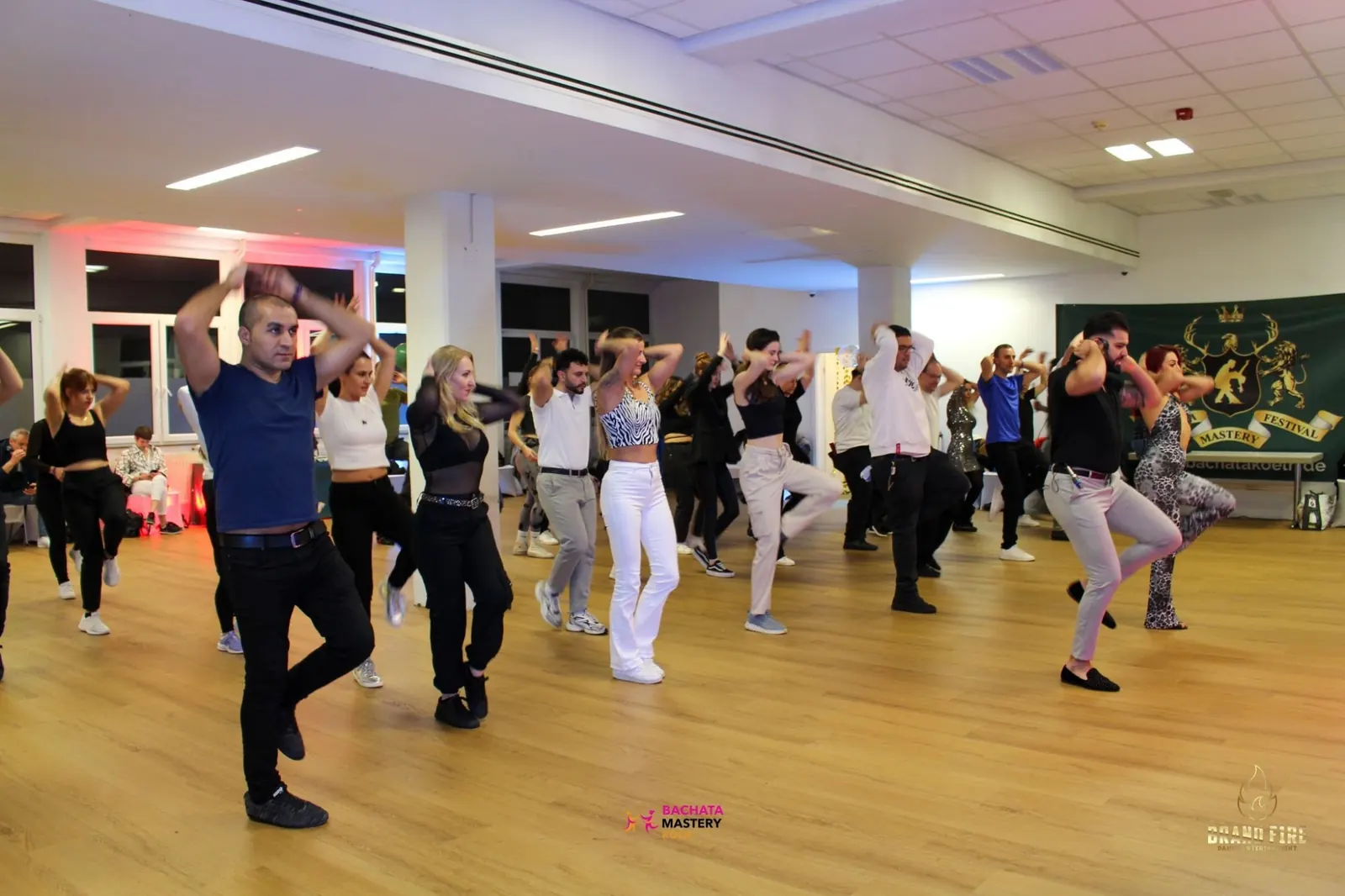 Group dance class on the wooden floor at Salsa Koeln in Cologne