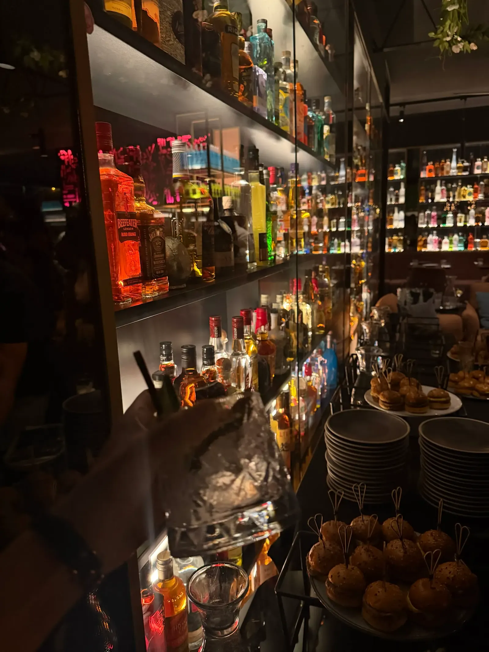 Backlit bar shelves with spirit bottles at The Albion Rooftop Melbourne