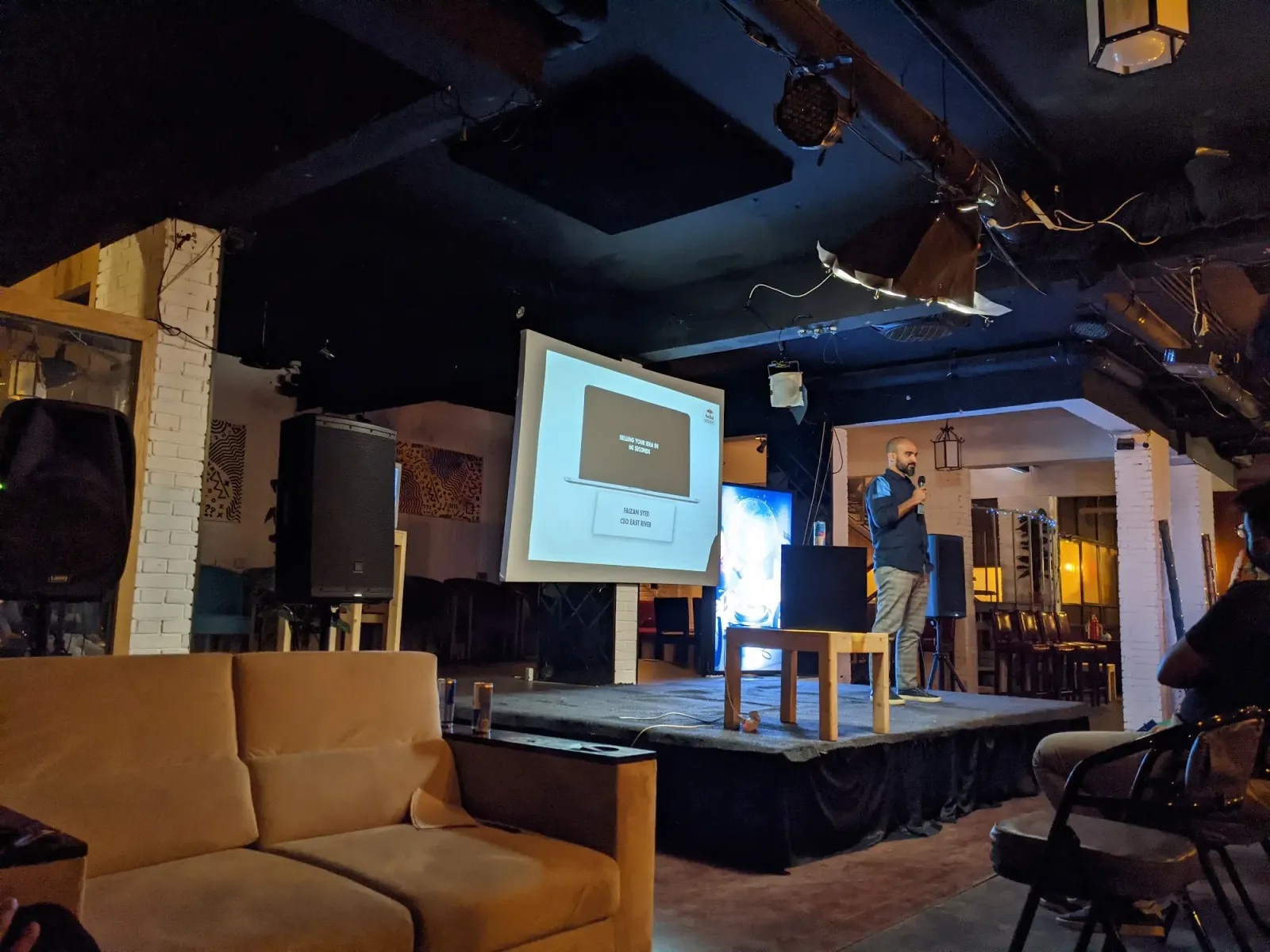 Club 432 Karachi lounge interior with exposed brick and stage setup