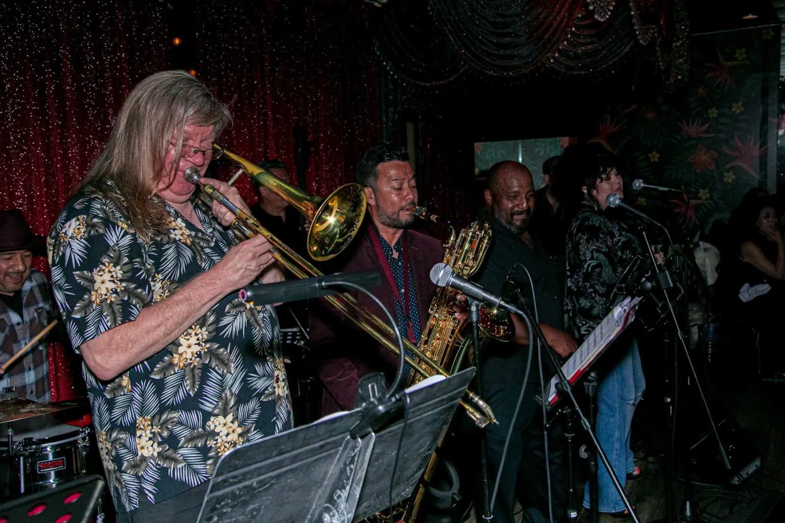 Live Latin band with horns playing on stage at El Floridita in Los Angeles