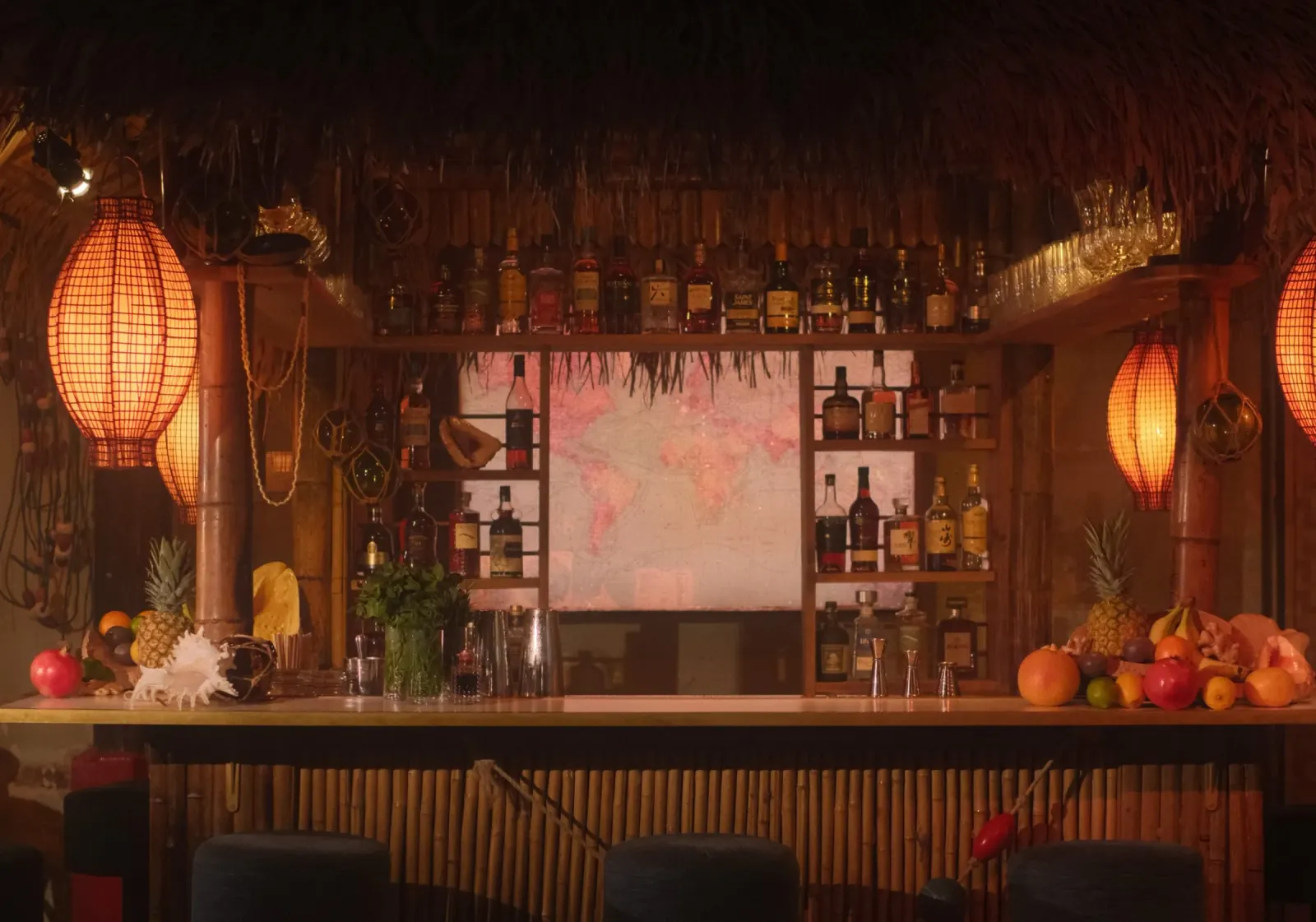 Tropical tiki-style bar interior with lanterns and bamboo at Le Comptoir Général Paris