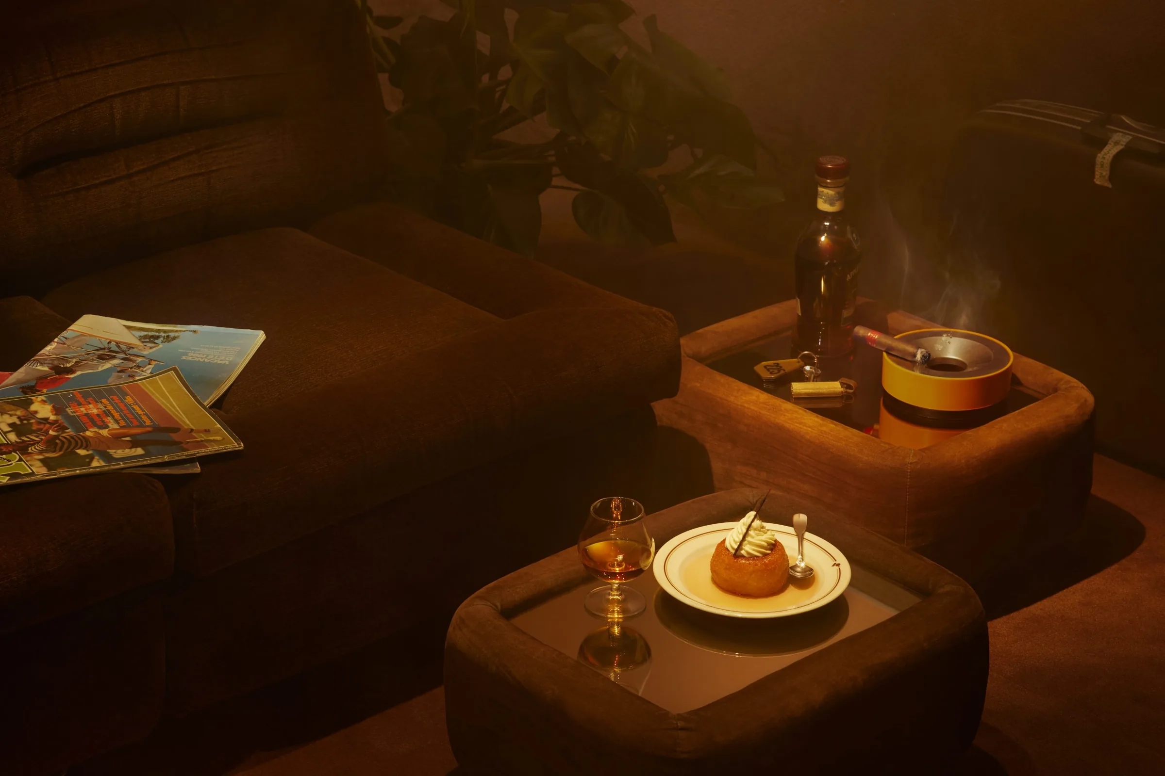 Cosy retro lounge seating with warm ambient lighting at Le Comptoir Général Paris