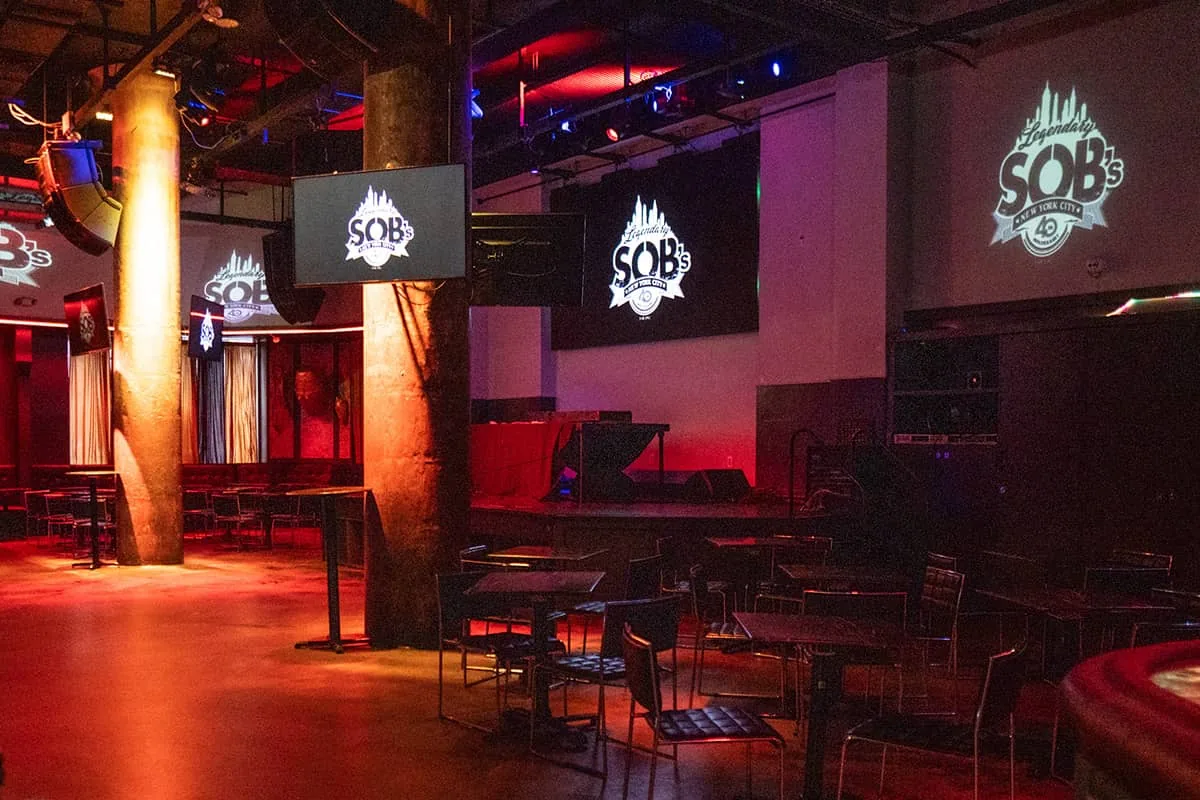 Sound of Brazil NYC stage area with SOB's branded screens and warm club lighting