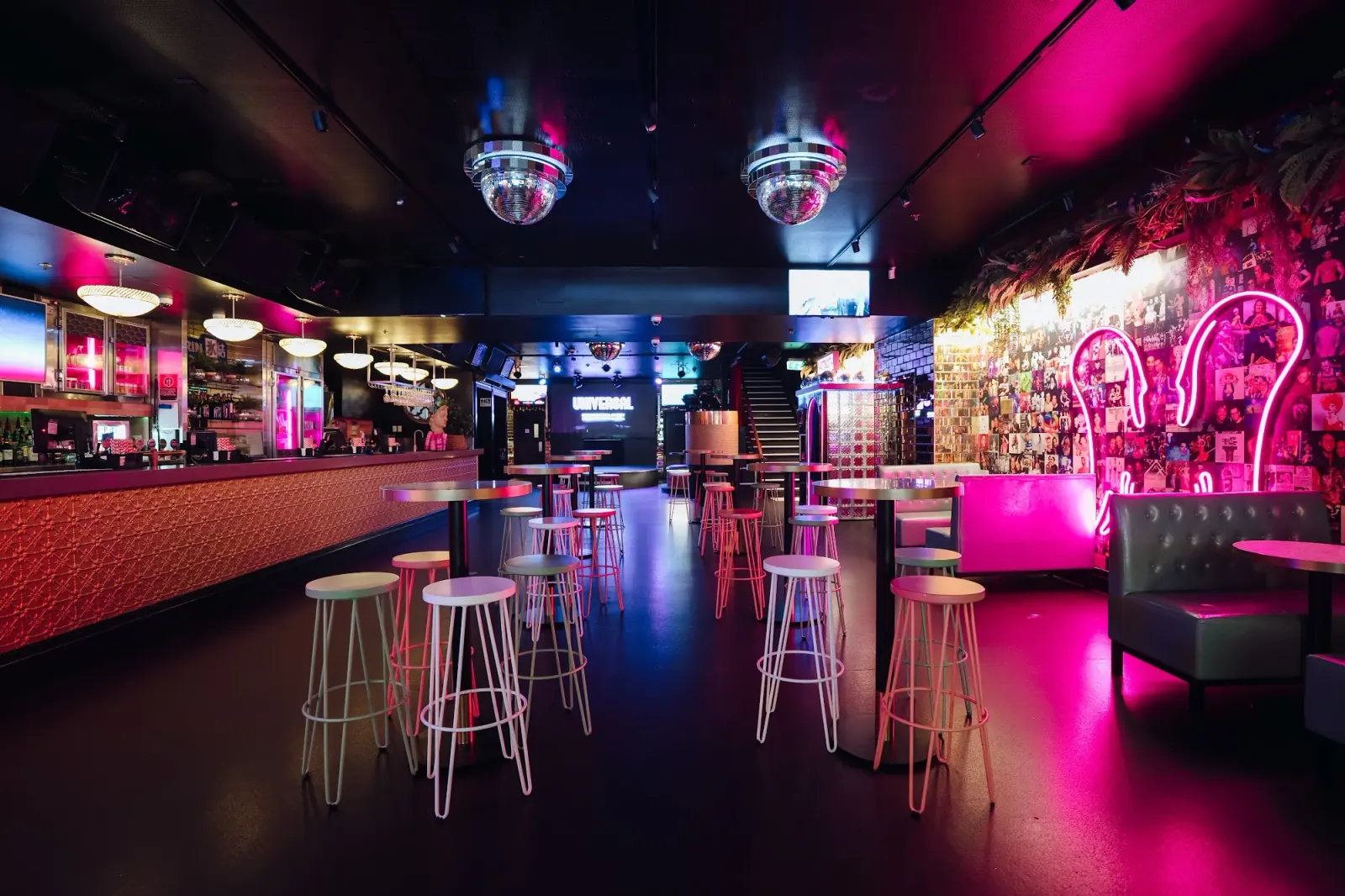 Dance floor with disco balls and neon lighting at Universal Sydney salsa venue
