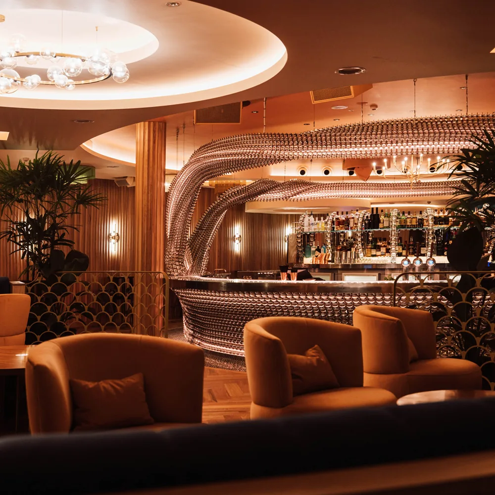 Signature curved bar and art deco lounge interior at Cloudland in Brisbane