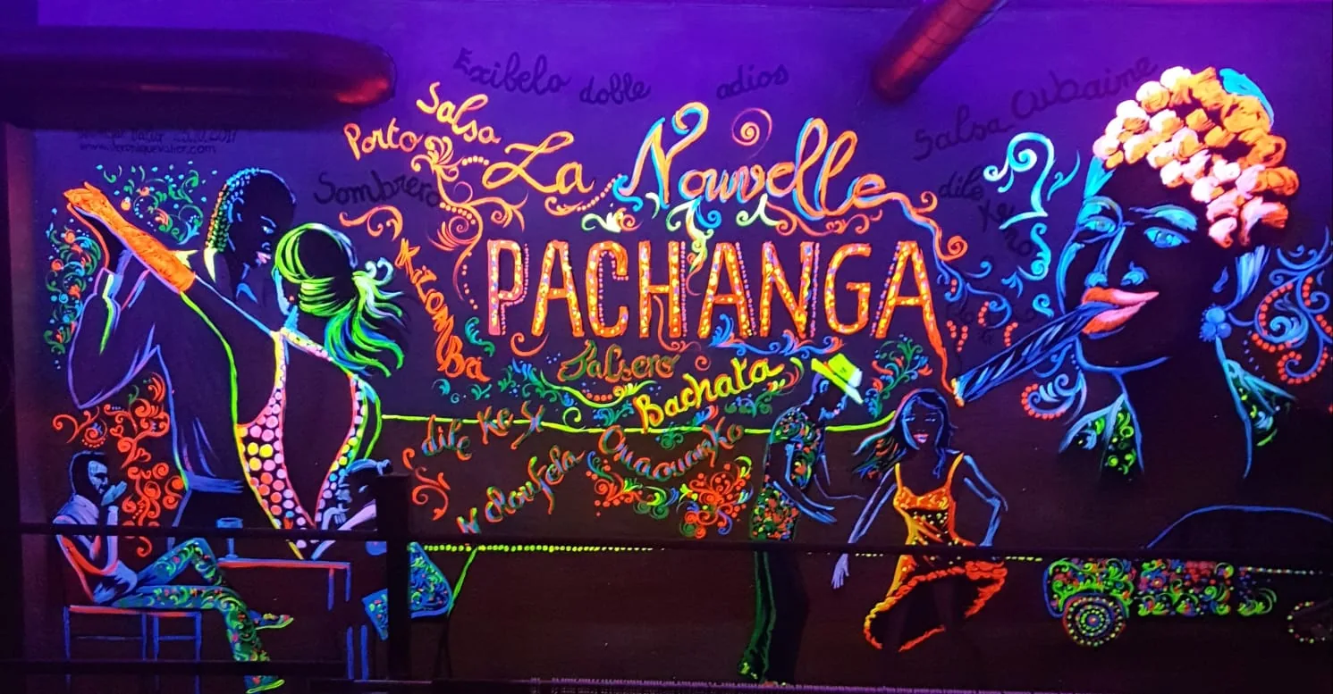 UV-lit Latin dance mural inside La Pachanga salsa and bachata club in Paris