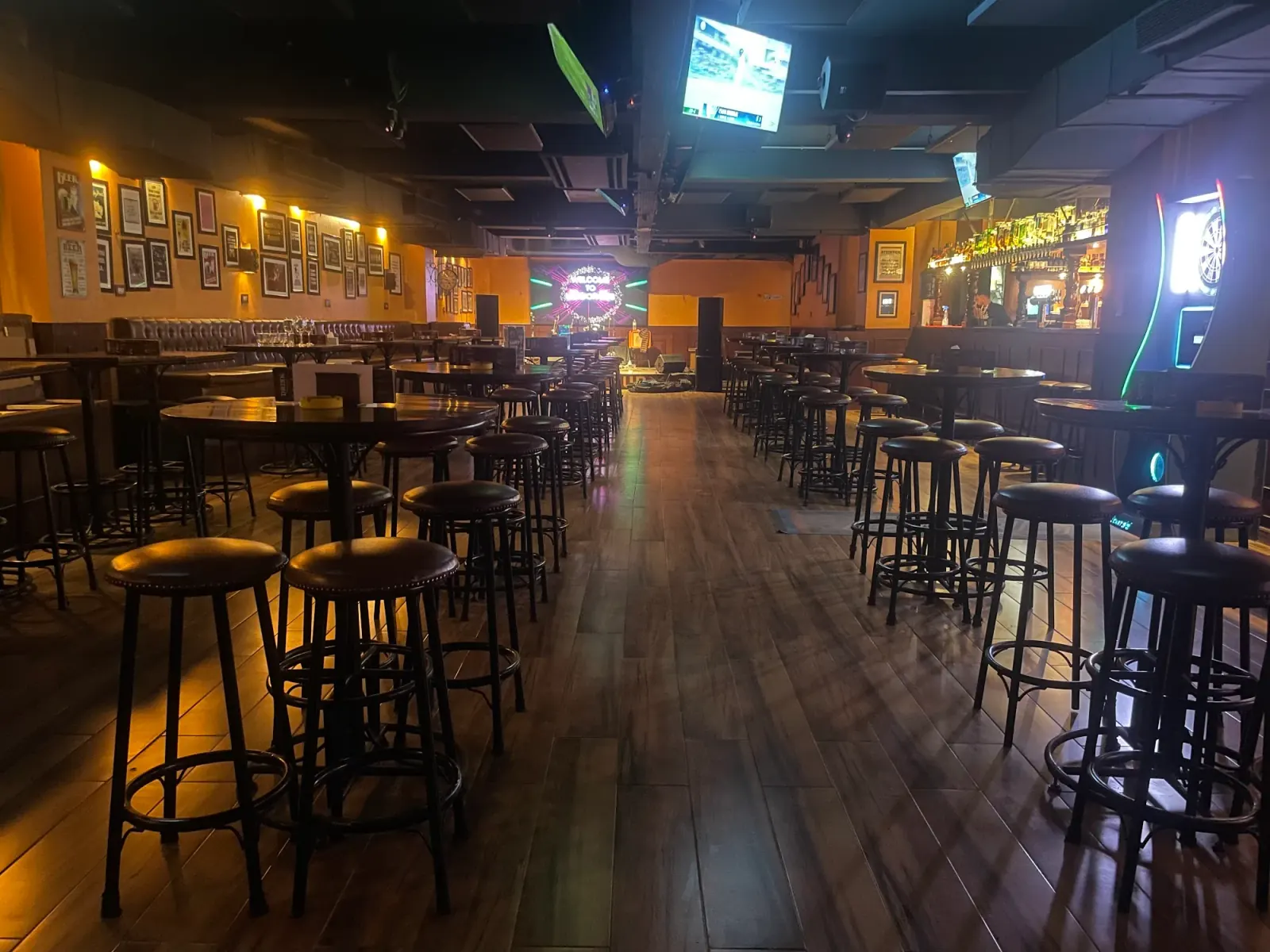 Empty interior of London Pub Kathmandu with bar stools, high tables and a dance floor space