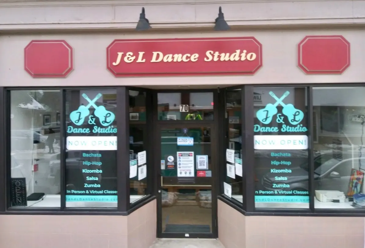 Storefront of J&L Dance Studio in Boston with the name board and Bachata, Kizomba and Salsa listed on the windows