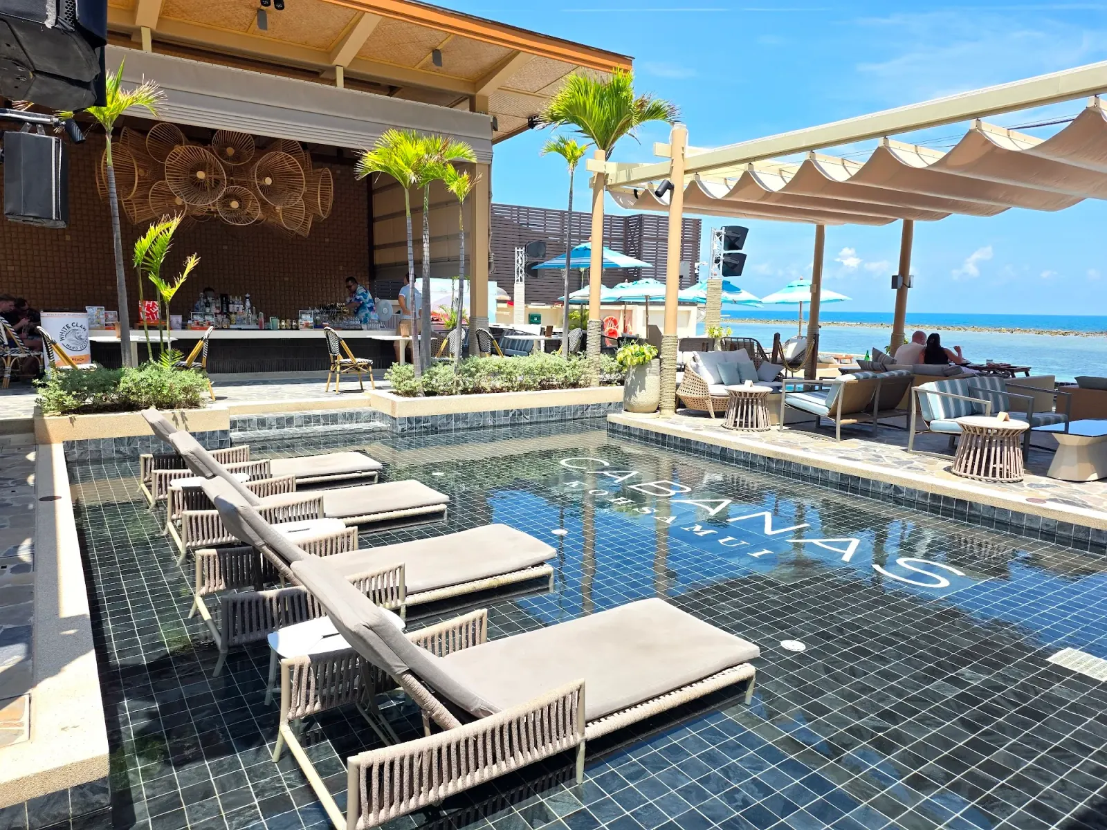 Cabanas Beach Club Koh Samui pool with sun loungers during daytime