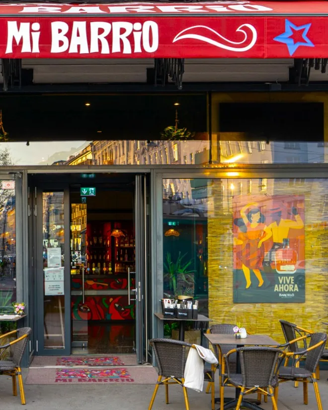MI Barrio venue exterior with branded red signage in Vienna