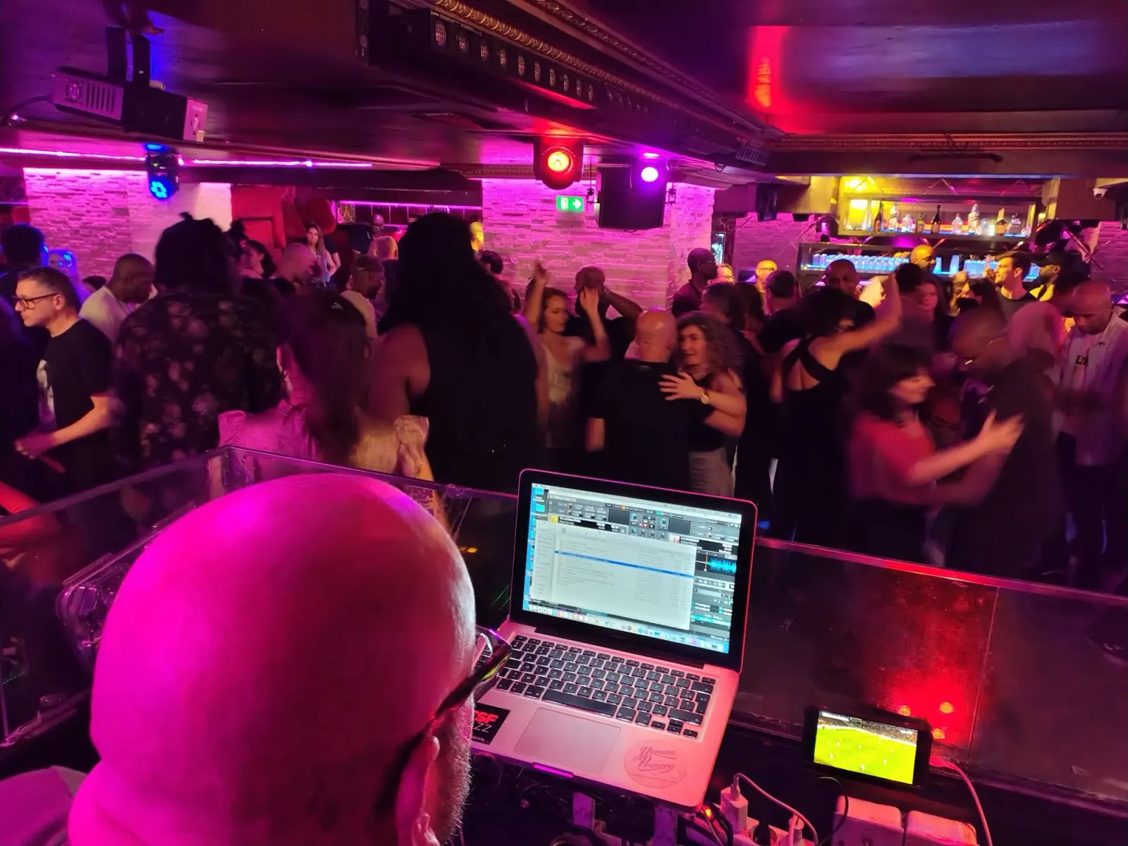 Crowded dance floor with DJ at Vendôme Club, Paris bachata and salsa night