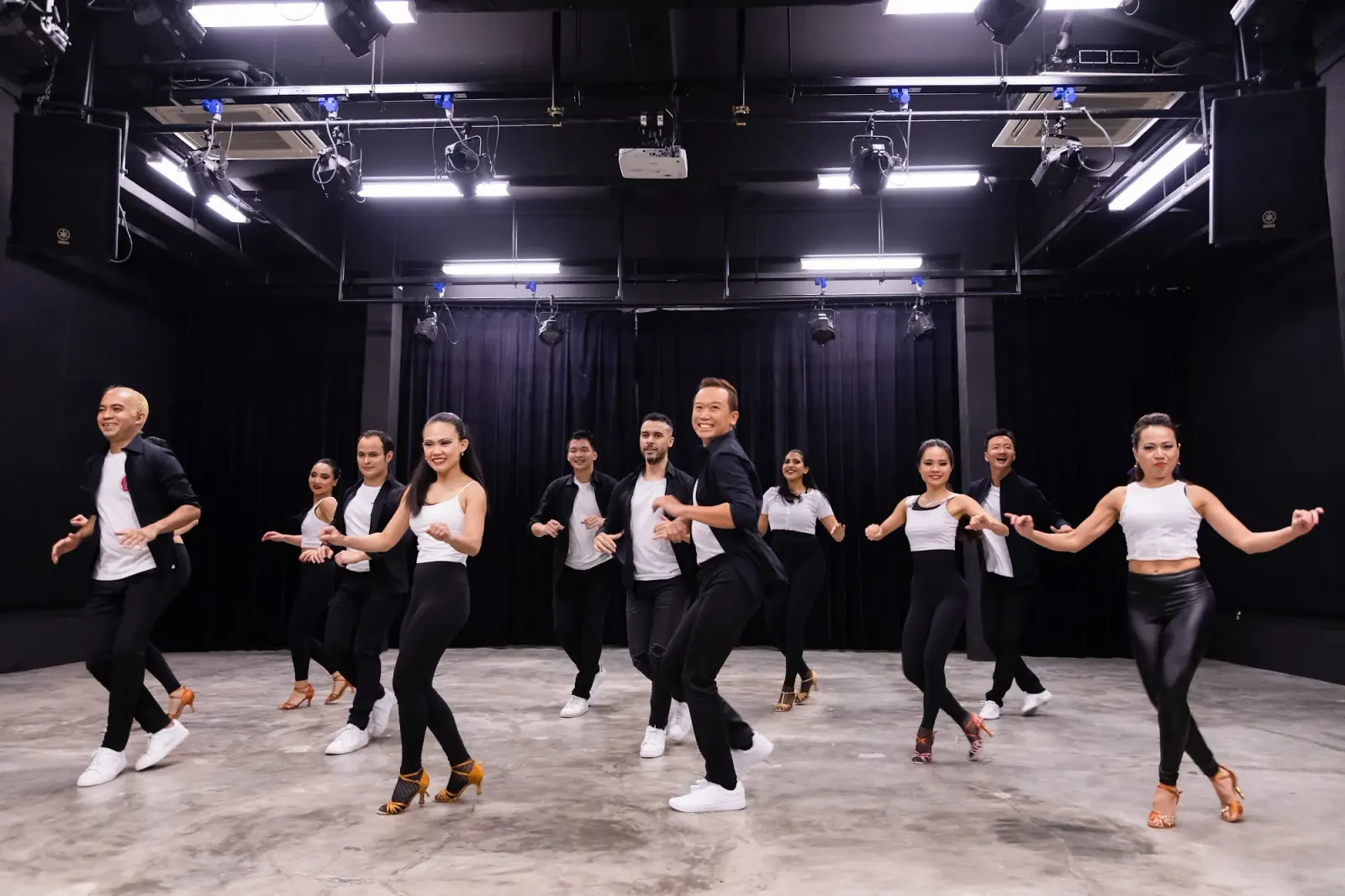 Dance class group performing choreography at Caliente Dance Studio Singapore