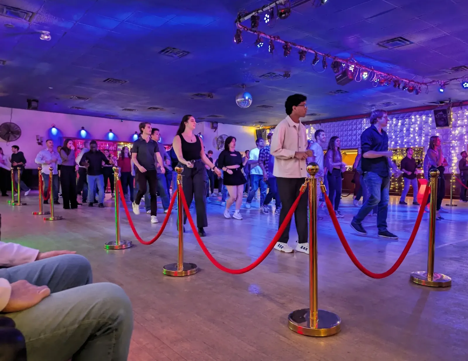 Dancers on the Havana Club dance floor under a disco ball in Cambridge