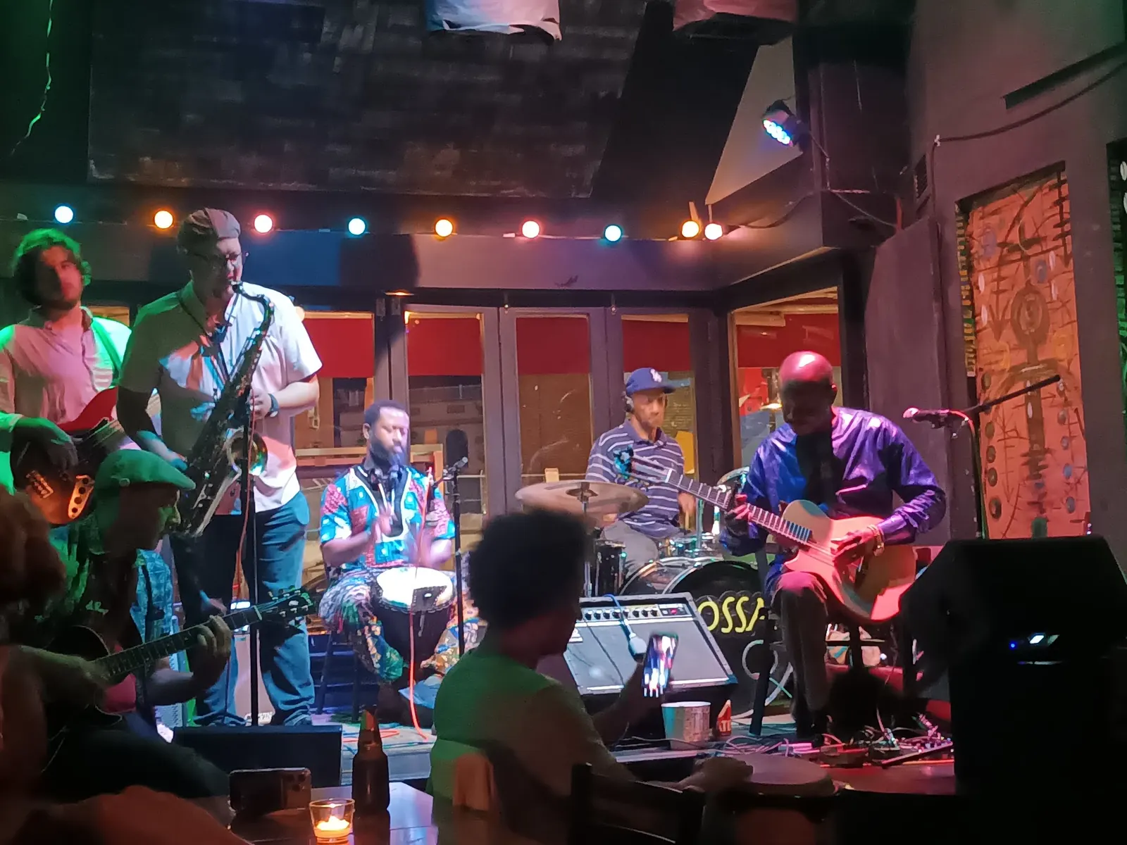 Live band with saxophone, guitars and drums on stage at Bossa Bistro and Lounge in Washington