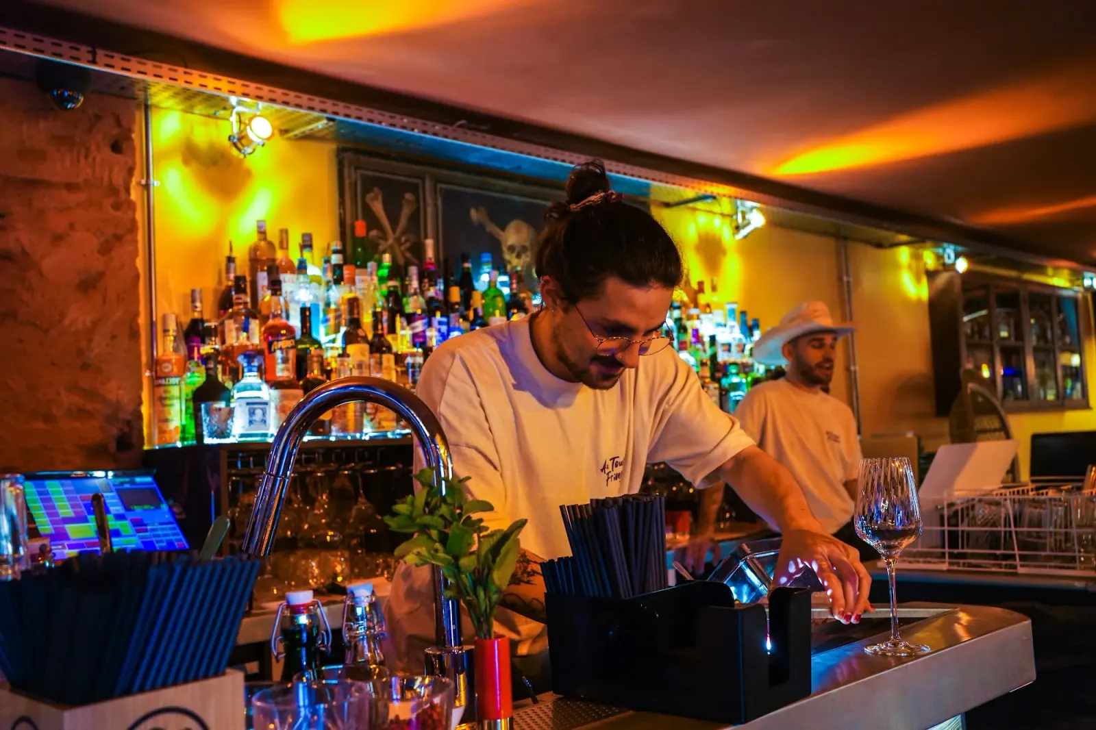 Warm bar interior with lounge seating and ambient lighting at Toucan Fringuant Bordeaux
