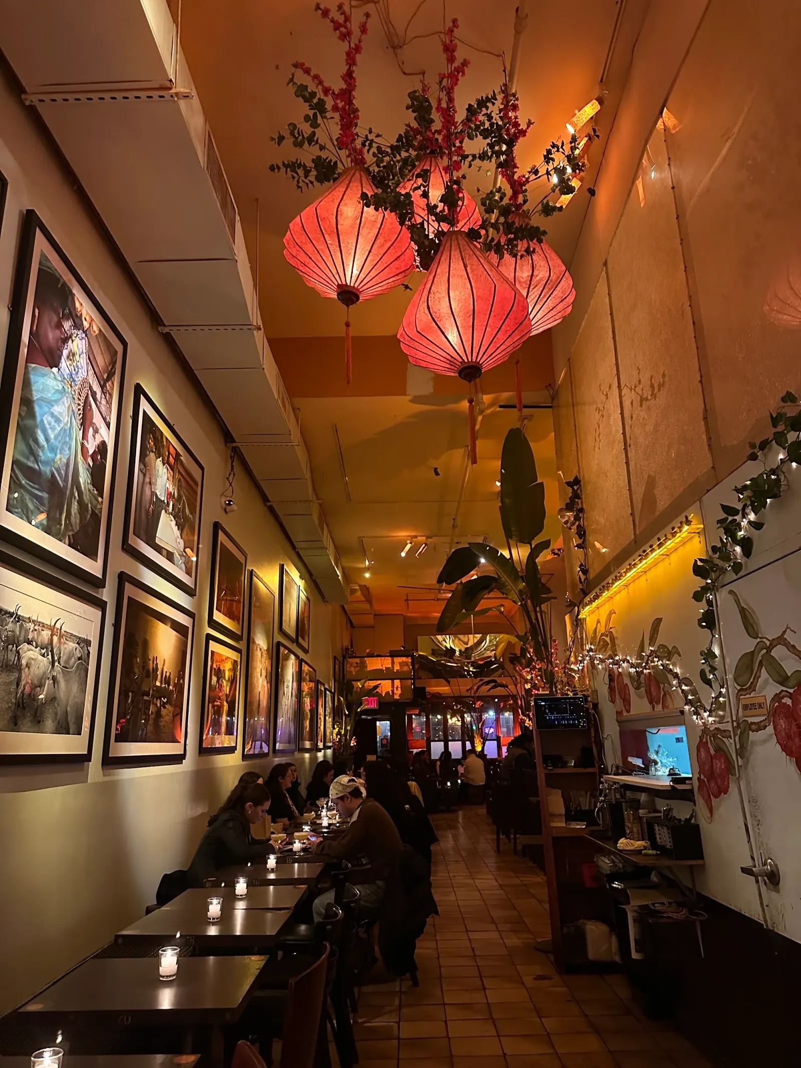 Cozy lounge interior with hanging lanterns at Verlaine bar in New York