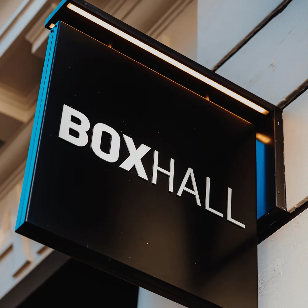 Boxhall City illuminated exterior sign mounted on the building facade