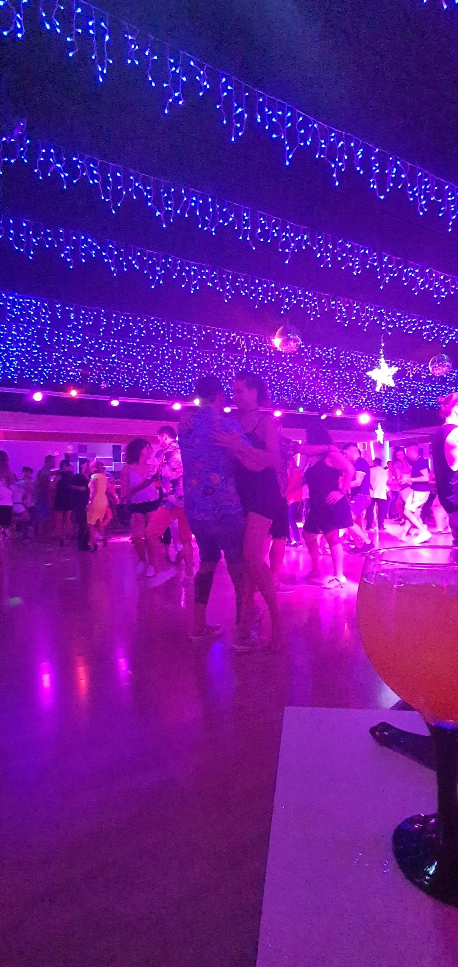 Dance floor with blue and purple lighting at Victory's venue in Palma de Mallorca