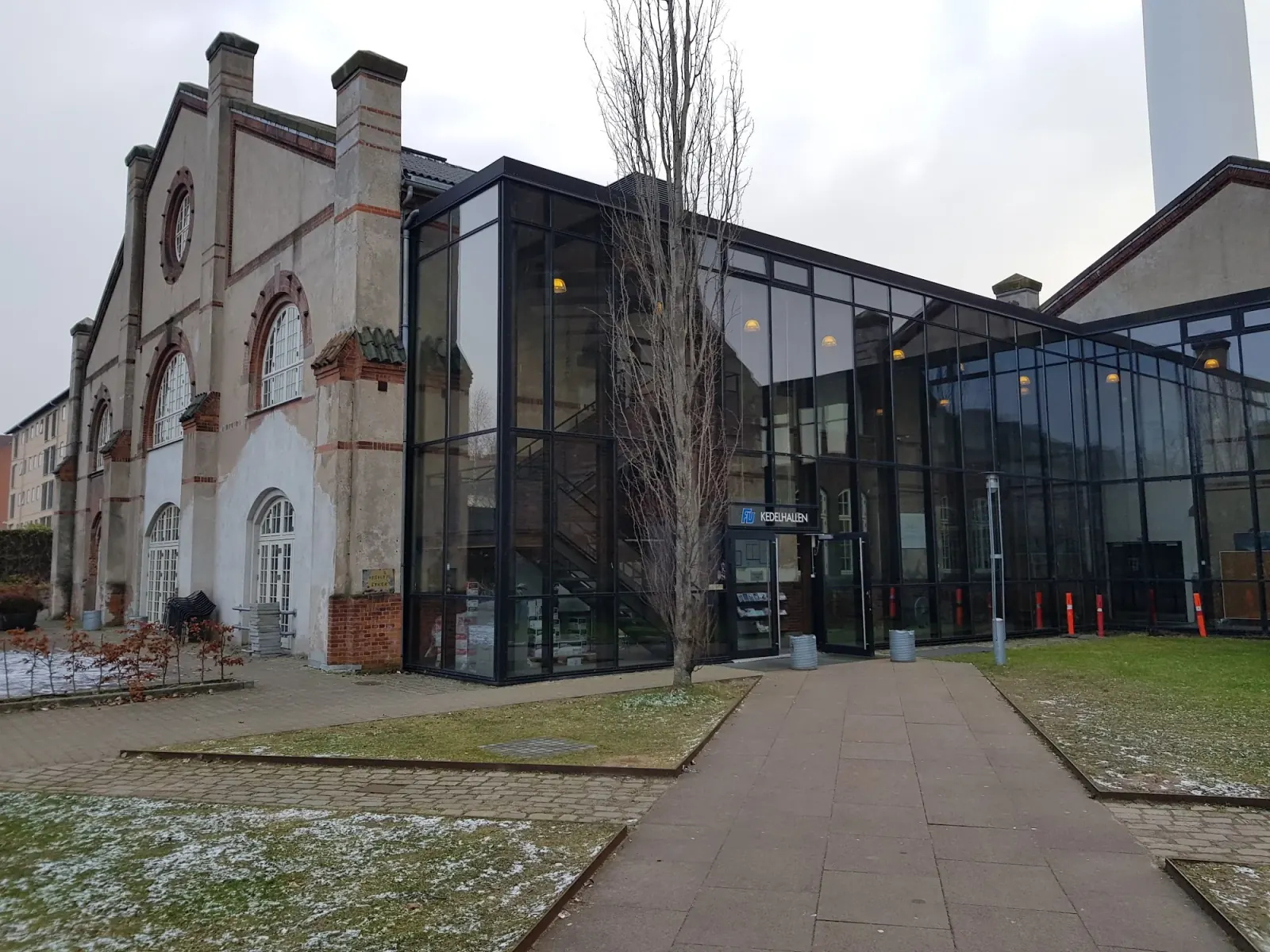 Historic industrial building exterior of Kedelhallen venue in Copenhagen Denmark