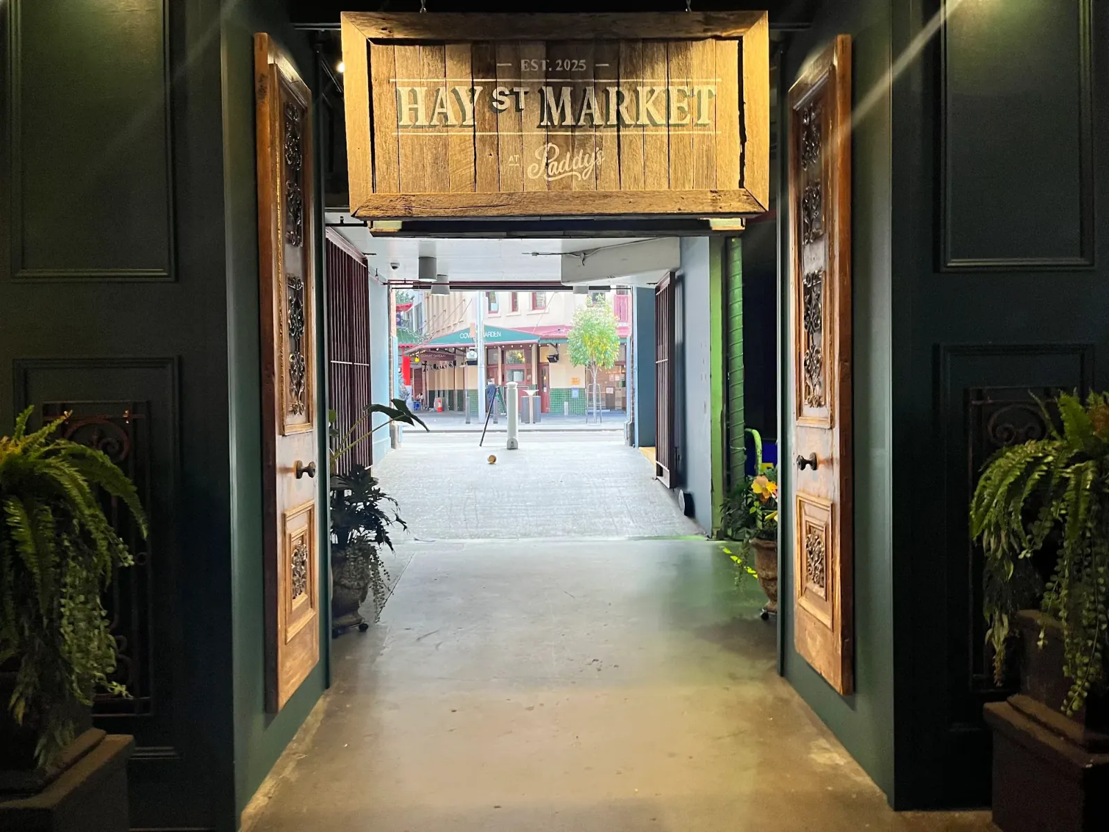 Hay St Market entrance with branded wooden signage in Sydney Haymarket