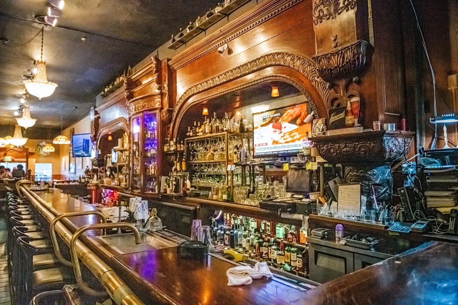 Ornate vintage wooden bar inside El Valenciano in San Francisco