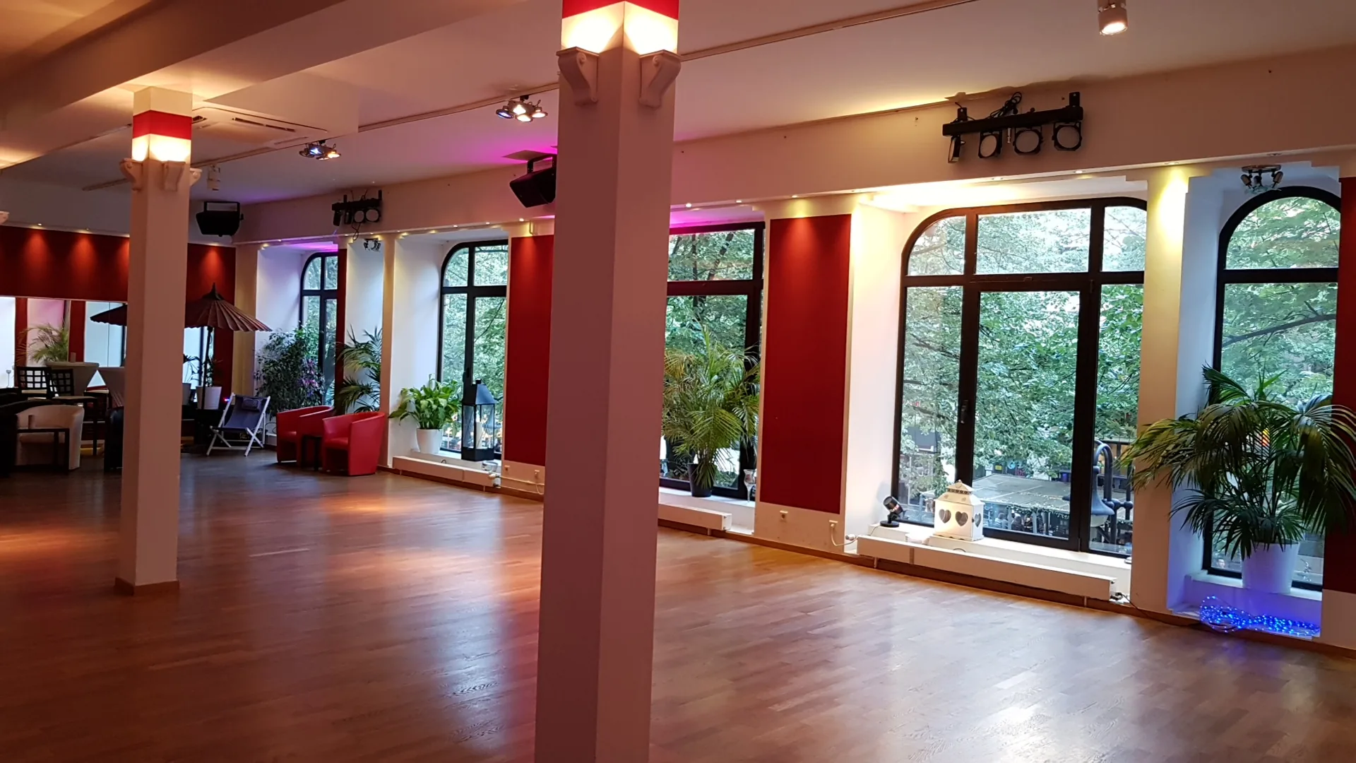 Large empty dance hall with arched windows at Dance School Monika Bauer Frankfurt