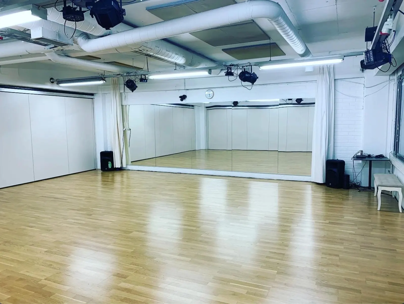 Wooden dance floor and mirrored studio at Helsinki Dance Central in Helsinki