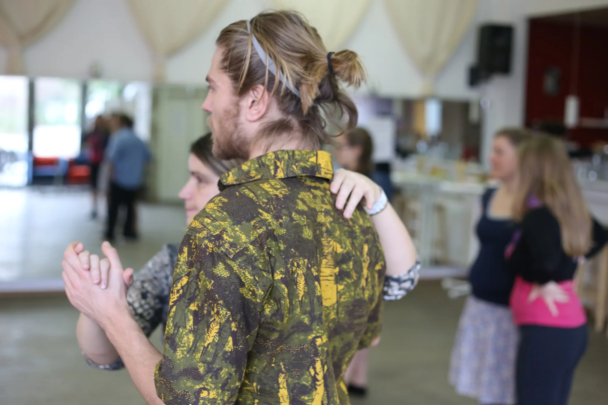 Partner dancing couple in close hold at Salsa Akademie Heidelberg dance studio