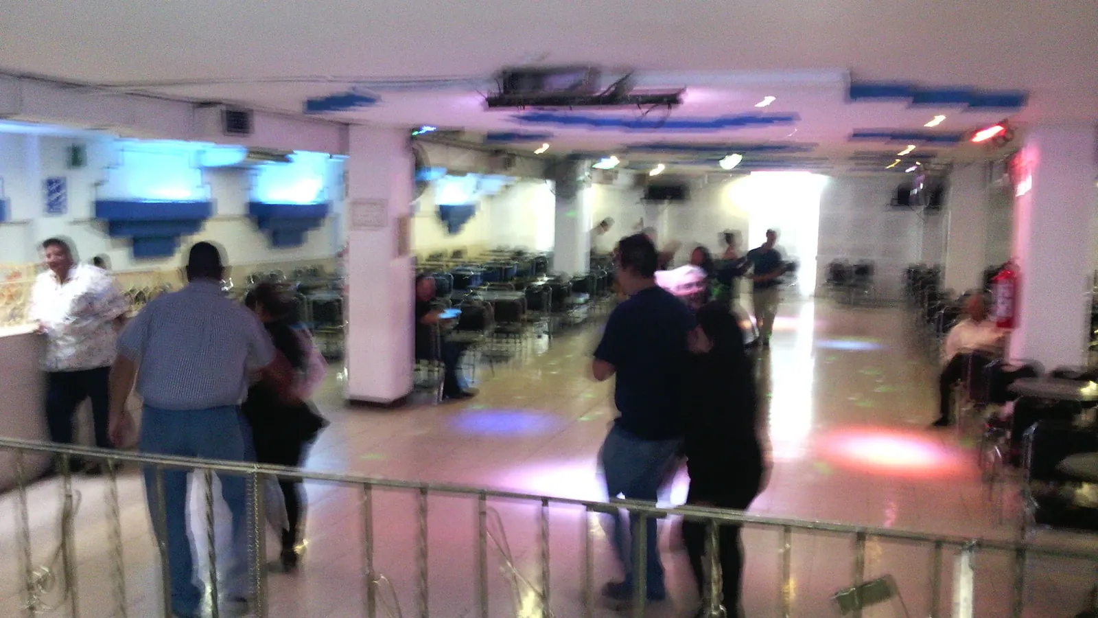 Couples dancing on the tiled floor of the hall at Salón Candela in Mexico City